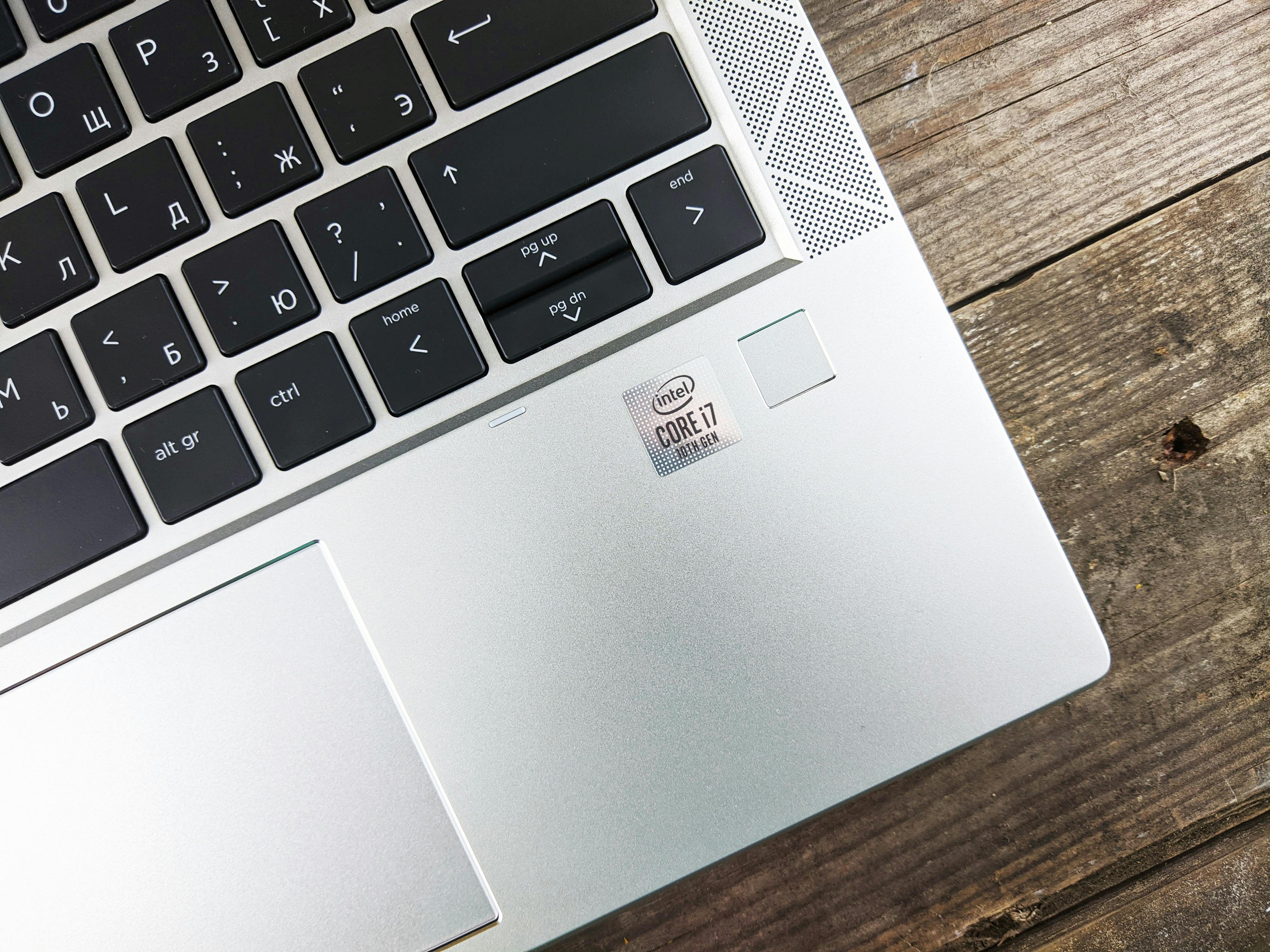 Silver Asus Laptop Computer On Brown Wooden Table Free Stock Photo