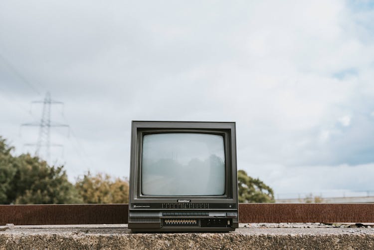 Retro TV Set Placed On Stone Surface