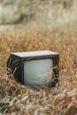 Used TV set on withered grass