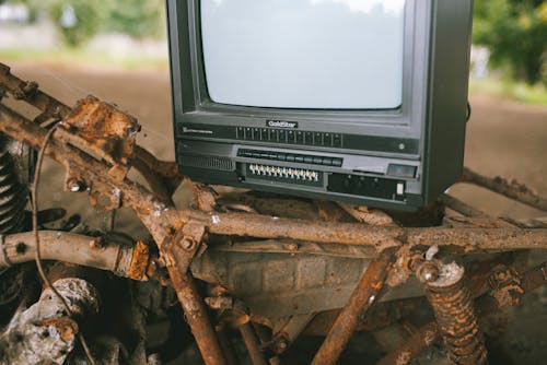 Old TV set placed on metal construction