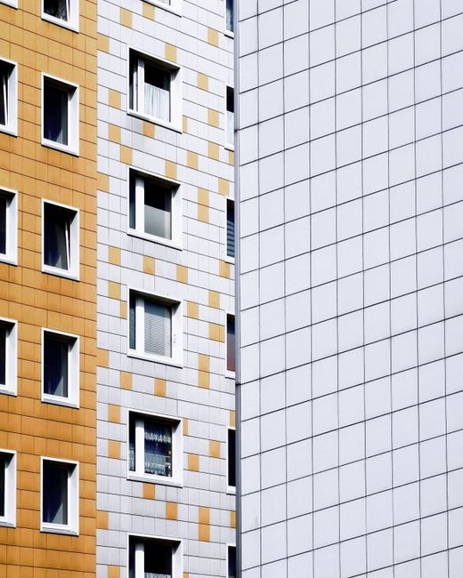 Explore the geometric design of Berlin's urban architecture with contrasting facades.