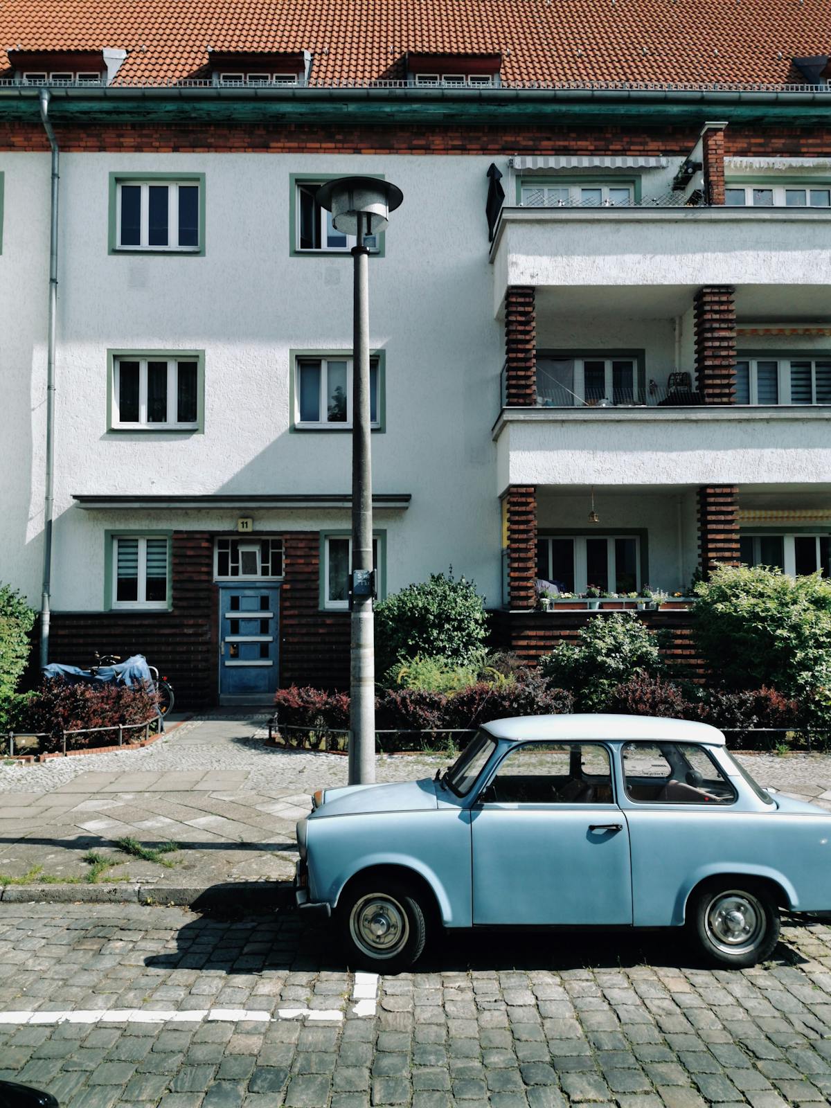 Snooker player leaning over the table to play a long red into the corner pocket