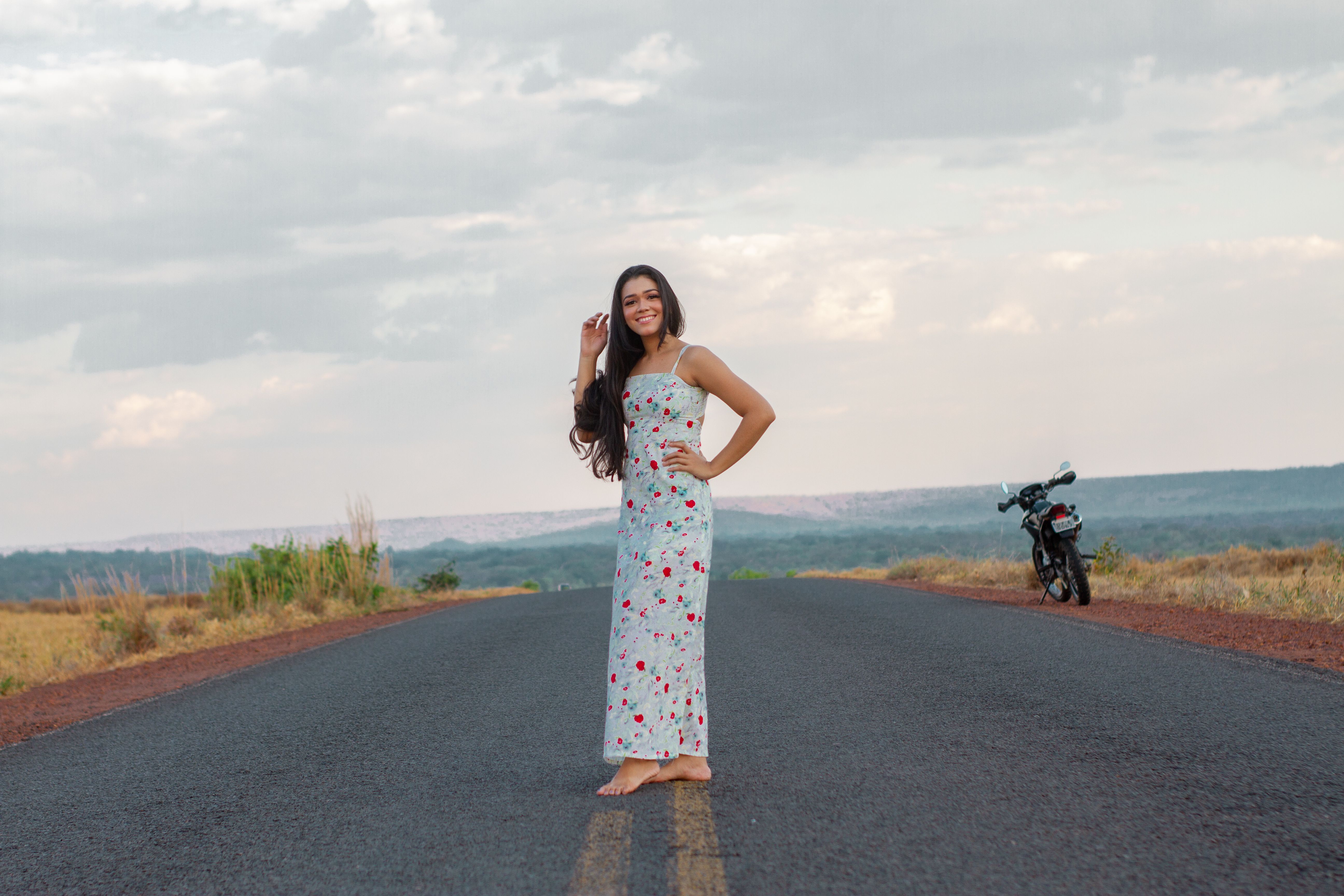 Portrait of Woman in Floral Dress on Desert Road · Free Stock Photo