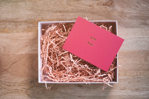 Greeting card representing With Love inscription on cardboard shavings