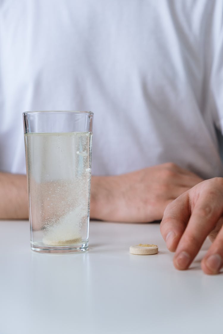 Effervescent Tablet Dissolving In A Glass Of Water