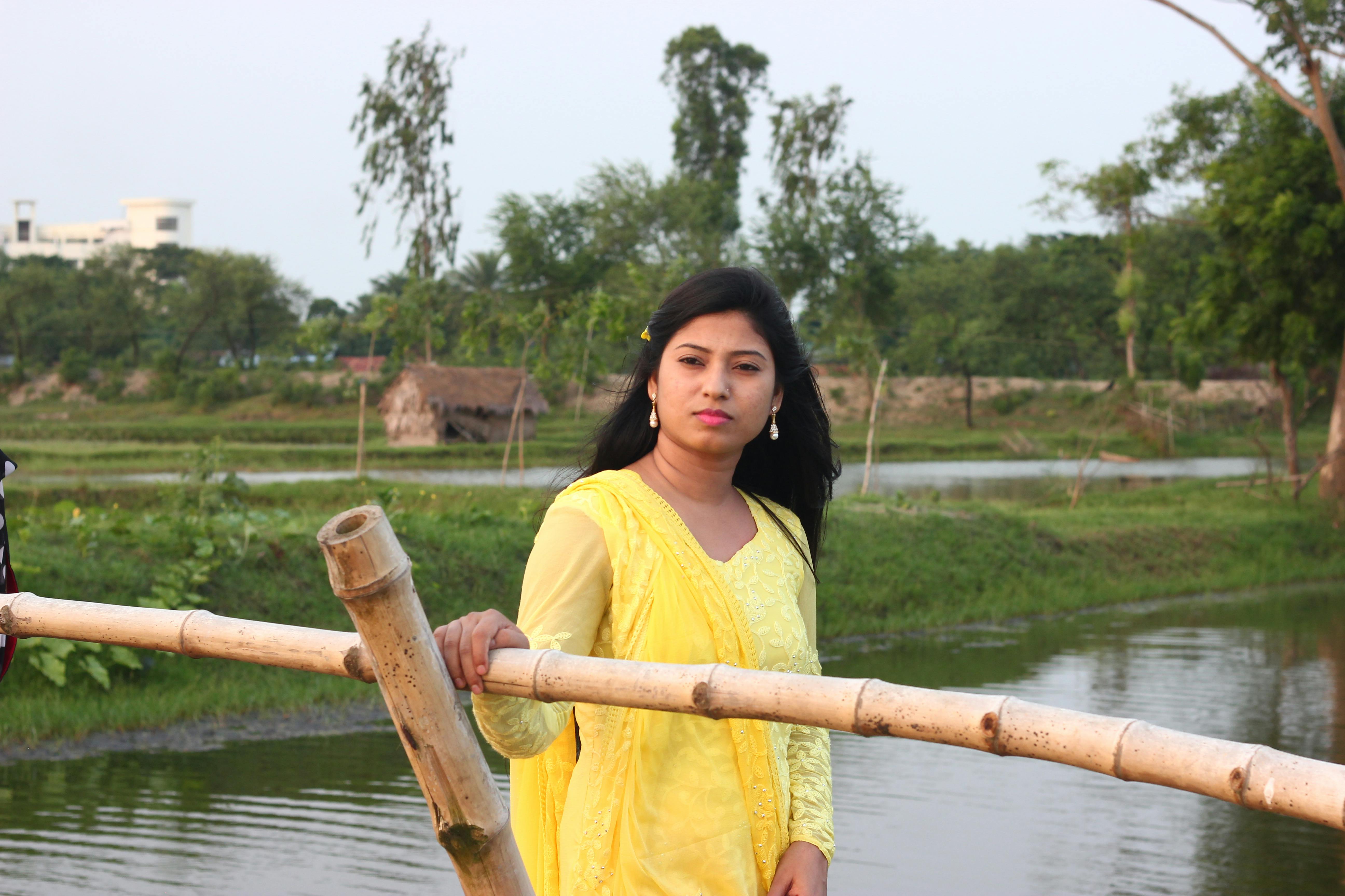 Scientists collaborating and writing equations on a glass board