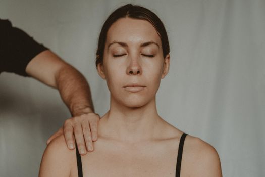 Crop man touching shoulder of woman
