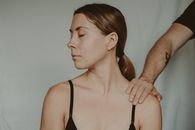 Crop man touching shoulder of woman