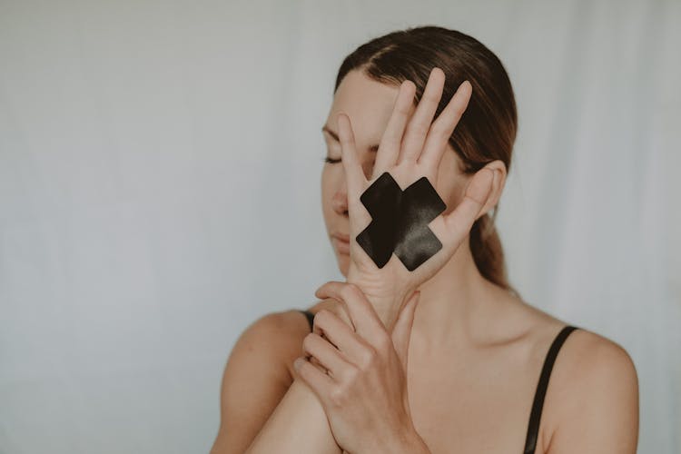 Female In Underwear Showing Hand With Stop Mark