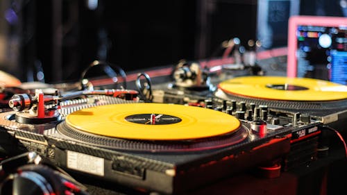 Free DJ console with records in nightclub Stock Photo