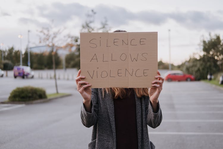 Anonymous Lady Showing Cardboard Fighting Against Violence