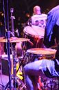 Crop drummer playing music during concert