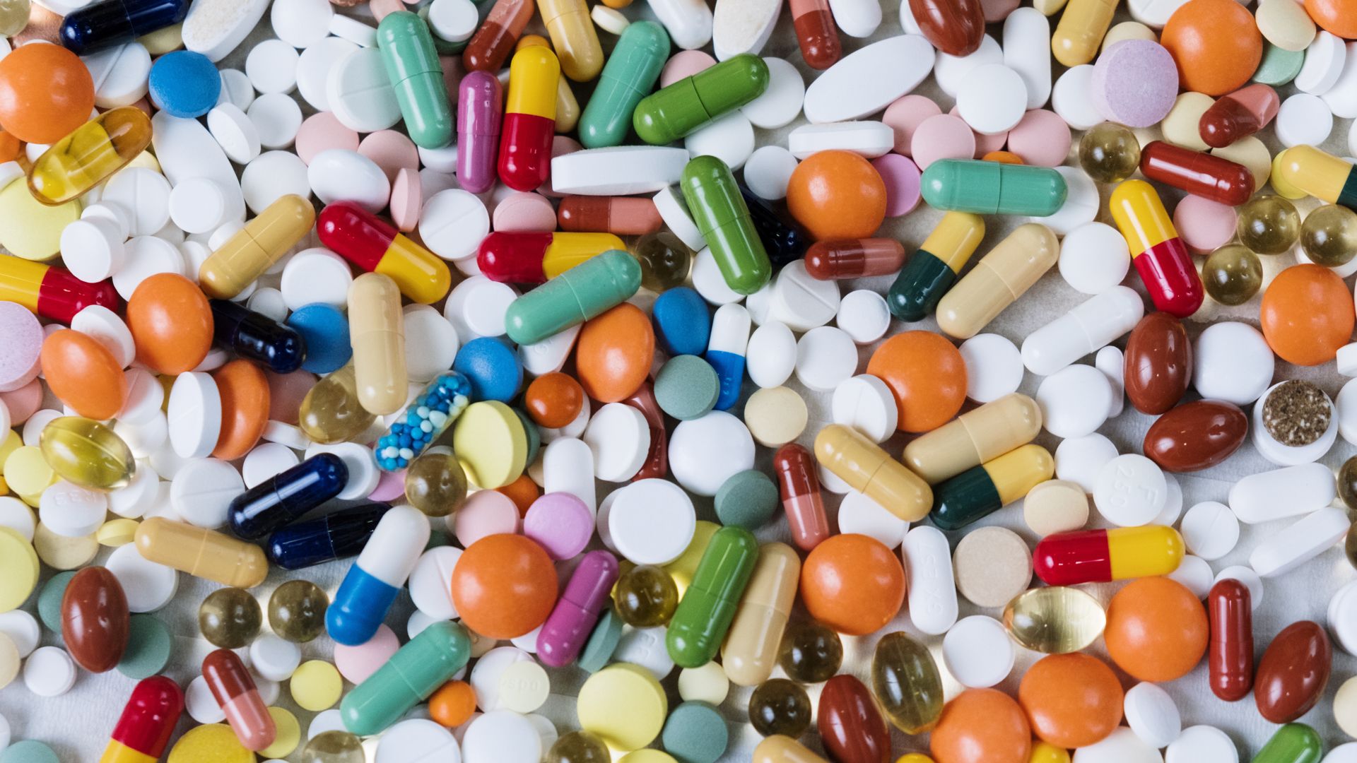 Hypersomnia Treatment Medication: Comprehensive Guide Vibrant assortment of medicine capsules and tablets in a flatlay format, highlighting diversity in pharmaceuticals — hypersomnia treatment medication