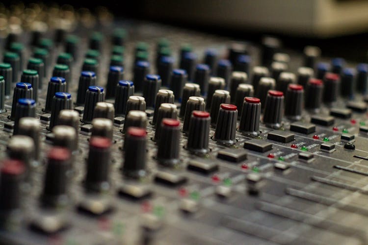 Sound Mixer With Rows Of Knobs In Recording Studio