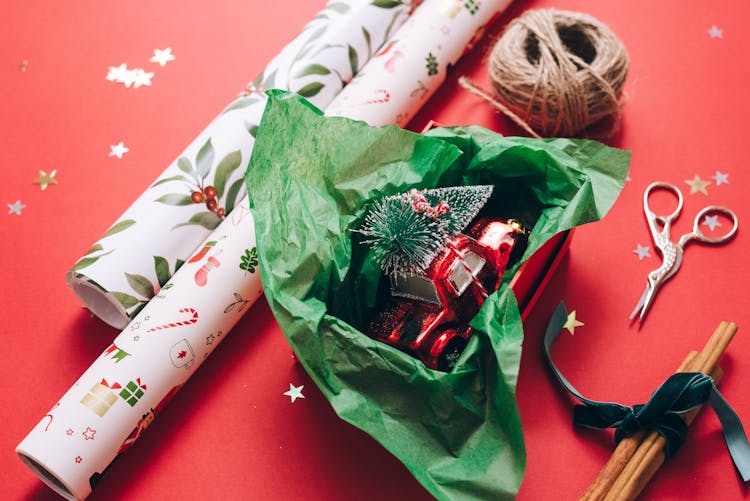 A Little Toy Car Carrying A Christmas Tree