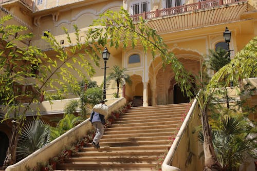 A Man Going Up the Steps of a Building