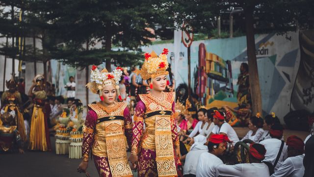Women in traditional costumes participating in a festival parade in Batam, Indonesia. — lounges at Batam Airport