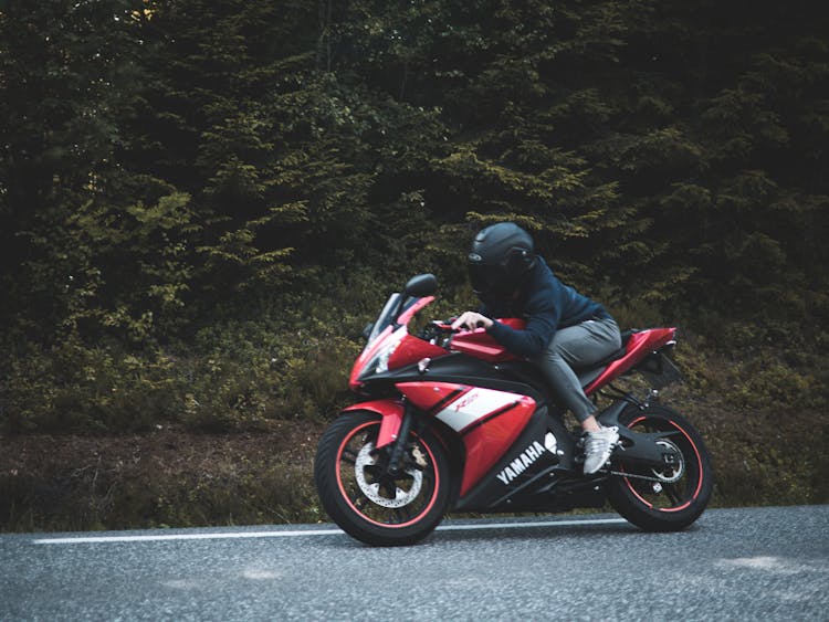 Person Riding On Sports Bike