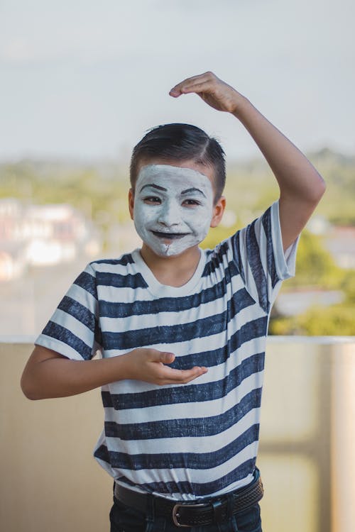 A Boy With Face Paint Wearing Black and White Striped Crew Neck T-shirt 
