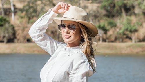 Woman in White Long Sleeve Shirt and Sunglasses