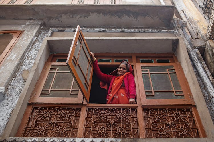 Smiling Indian Woman In Ornamental Window