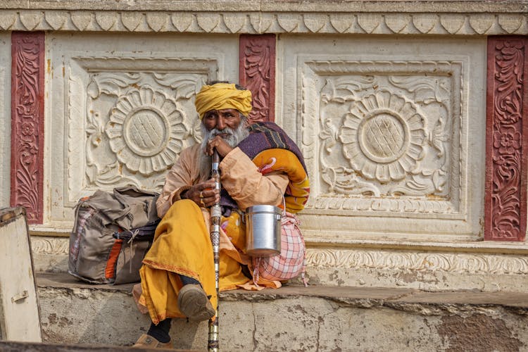 Senior Hindu Man With Cane On Street