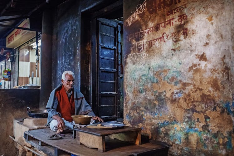 Elderly Ethnic Man On Local Street Bazaar