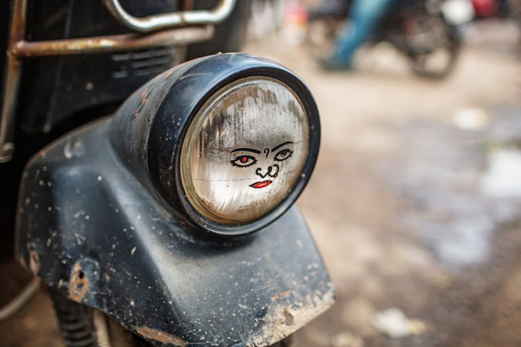 Aged Car Headlight With Indian Woman Drawing