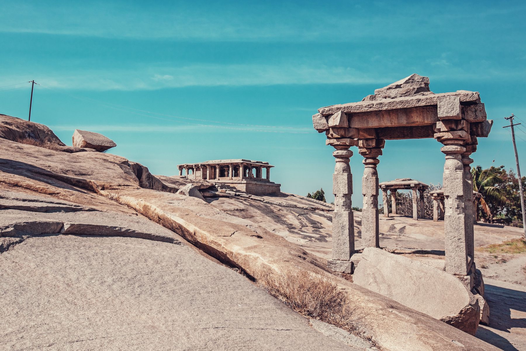 Granite boulders and a stone temple gopuram above the Tungabhadra river
