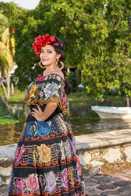 Smiling Woman in Long Floral Dress Posing 