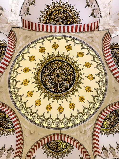Free Ornate geometric ceiling design with Islamic art and patterns in mosque interior. Stock Photo