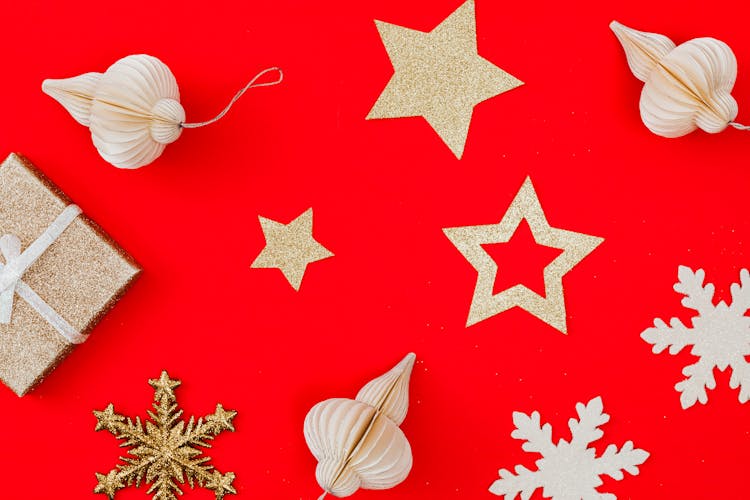 Christmas Ornaments Against A Red Background