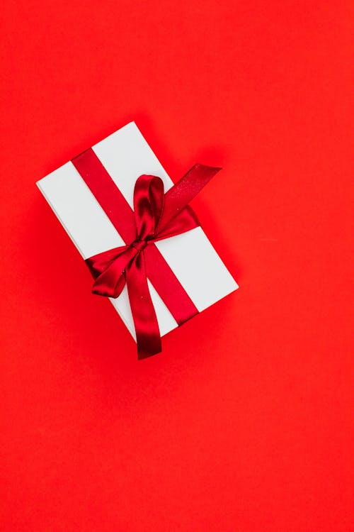 A Gift Box on a Red Background