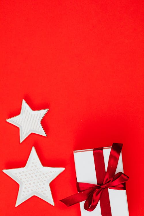 Stars and Gift on Red Background