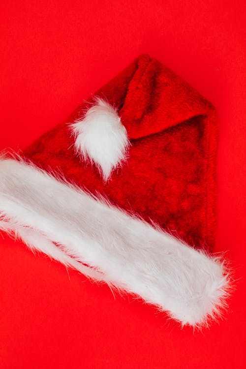 Santa Hat on Red Studio Background