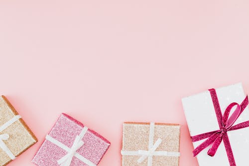 Free Presents Wrapped in Glitter Paper  Stock Photo