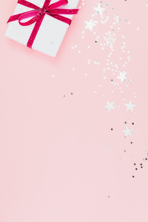 Free Close-Up Shot of a Gift Wrapped with Pink Ribbon Stock Photo