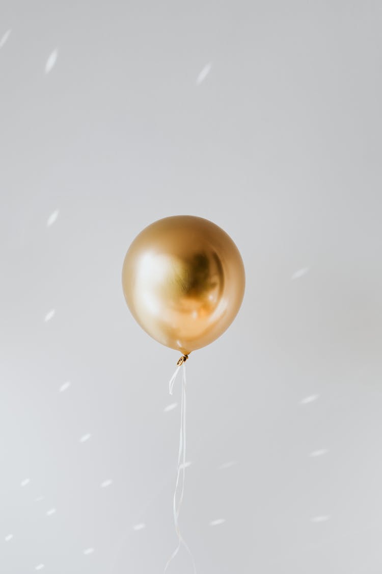 Close-Up Shot Of A Gold Balloon 