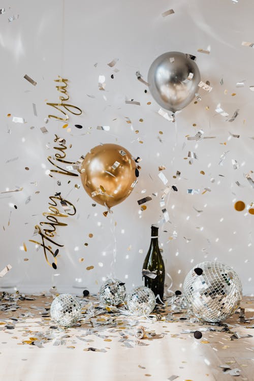 Free Gold Baubles on White Surface Stock Photo