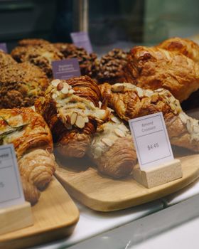 Close-up of freshly baked almond croissants at a Toronto bakery.
