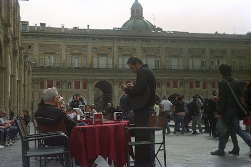 People and Coffee Tables In A Public Square