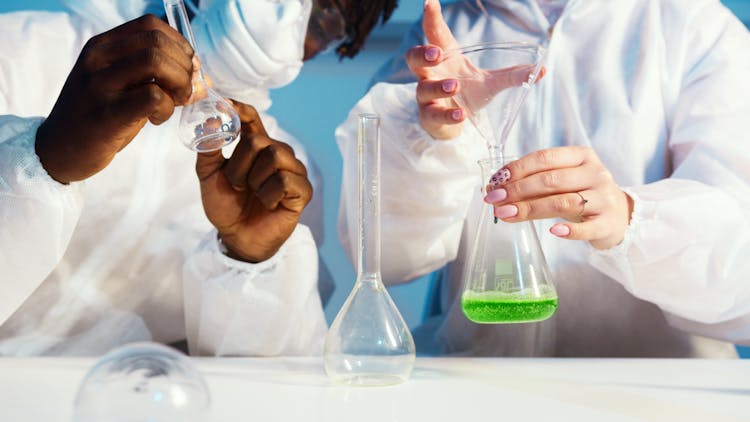 A Man And A Woman Doing An Experiment