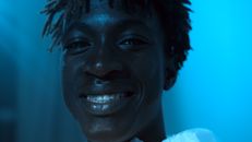 Close-Up View of a Man Smiling While Looking at the Camera