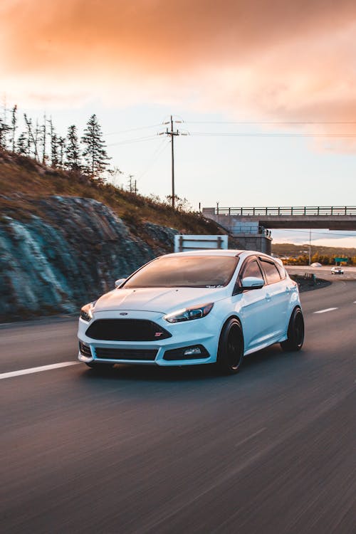 Modern sports car driving through countryside