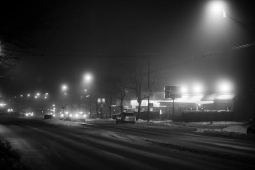 Black and White Photo of City on Winter Night 