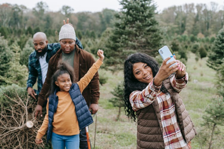 Cheerful Black Family Taking Selfie In Countryside