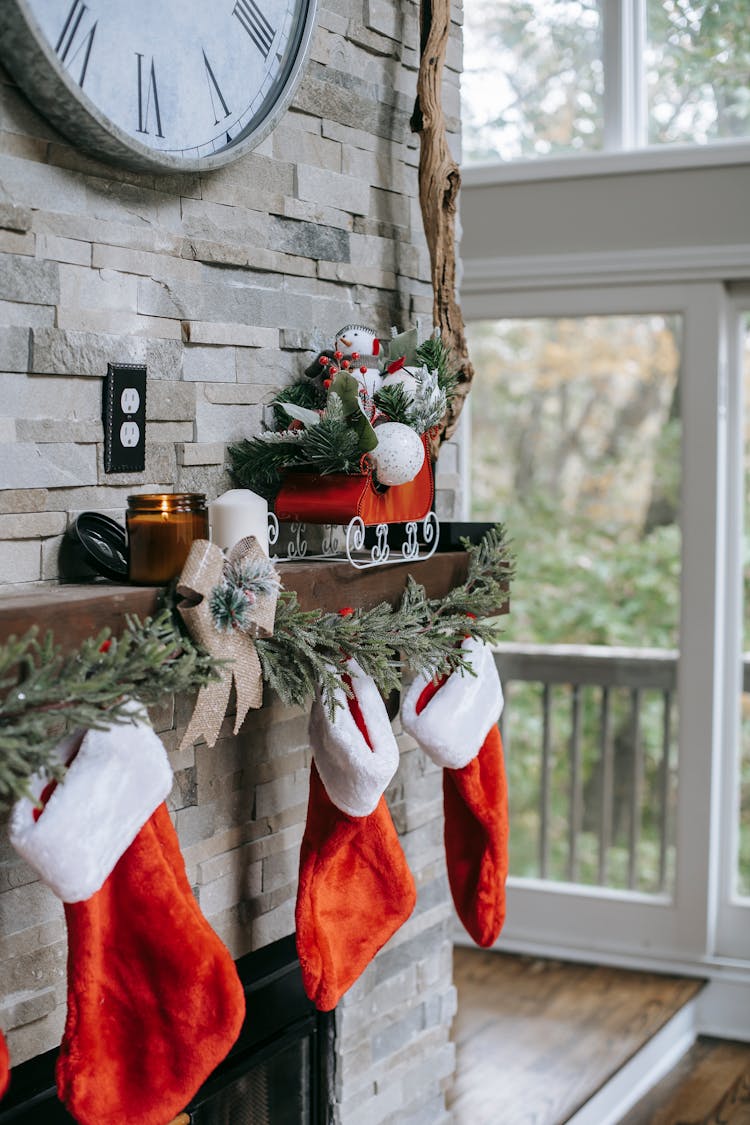 Xmas Decorations On Brick Wall Above Fireplace