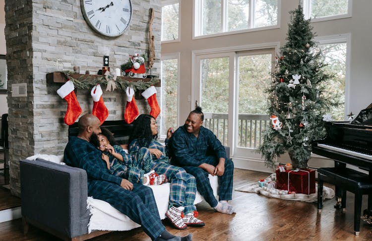 Happy Black Family Enjoying Christmas Holidays At Home