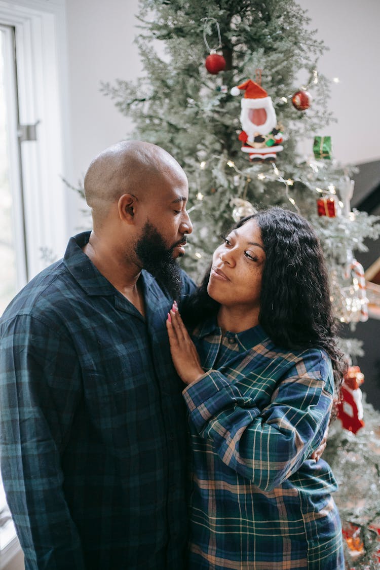 Loving Black Couple Hugging Near Christmas Tree