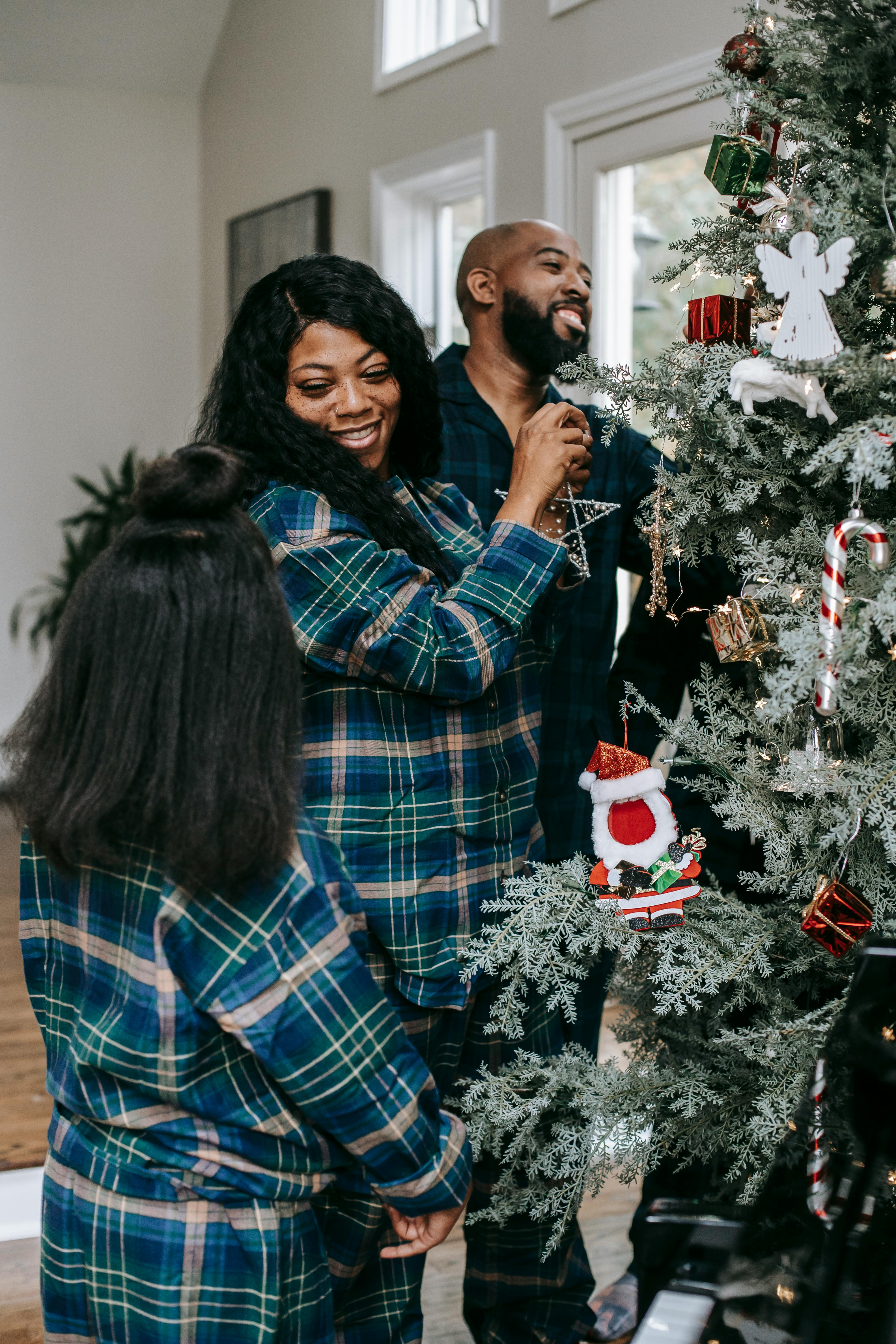 cheerful black family enjoying christmas preparation